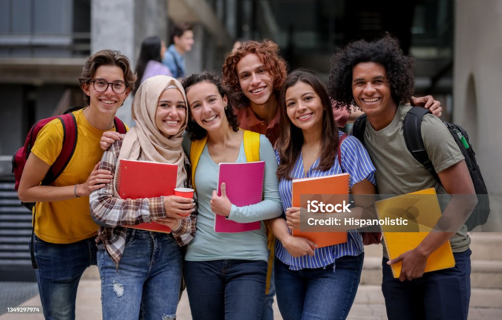 Multi-ethnic group of Latin American college students smiling Multi-ethnic group of Latin American college students smiling at the university campus and looking at the camera - education concepts University Student Stock Photo