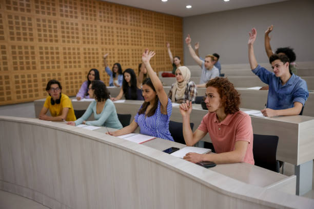 istock Students asking questions to the teacher in class 1349297992