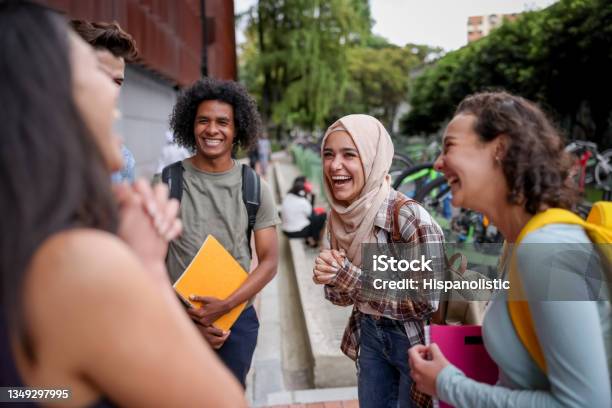Multiethnic Group Of Students Looking Happy Talking At The School And Laughing Stock Photo - Download Image Now