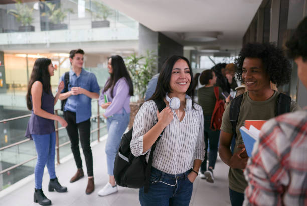 istock Happy group of students talking at the school 1349298028