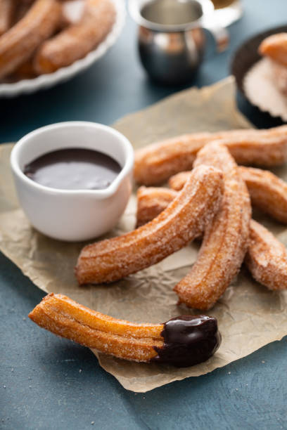 istock Homemade churros with cinnamon sugar on parchment 1349299911