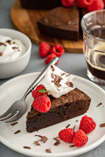 istock Brownie cake topped with fresh raspberries 1349299949