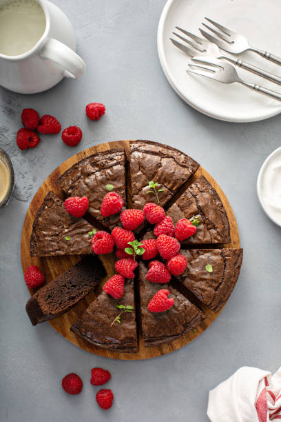 istock Brownie cake topped with fresh raspberries 1349299952