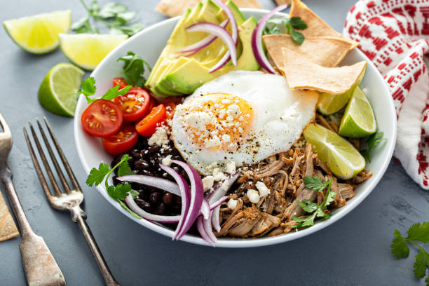 istock Breakfast burrito bowl with pork carnitas and rice 1349299966