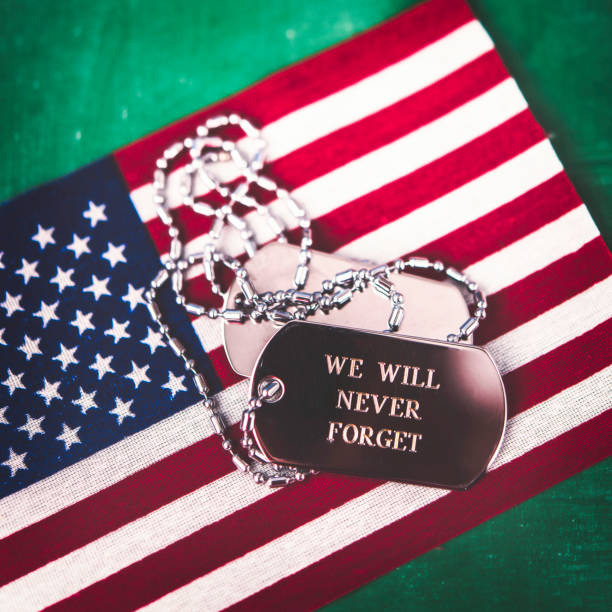 istock American Flag with Dog Tags Reading We Will Never Forget 1349300751