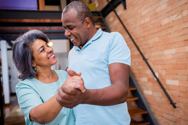 istock Mature couple dancing at home 1349300759