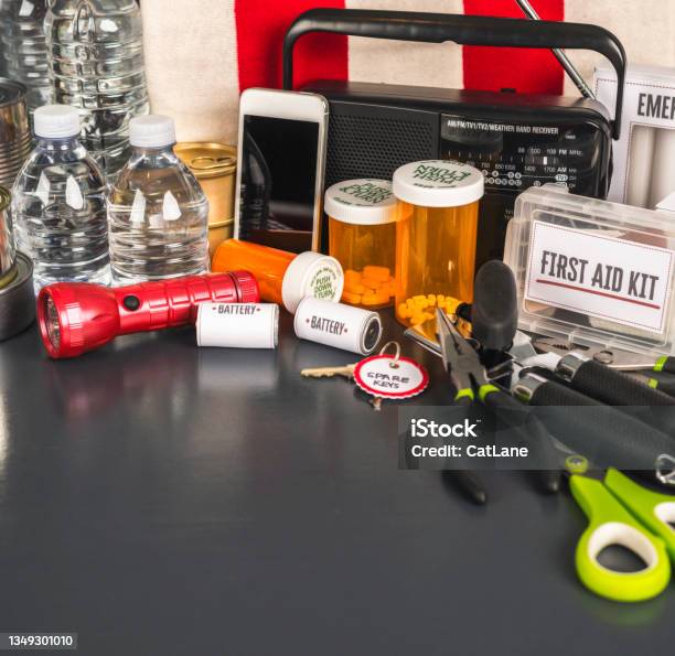 Disaster Preparation Kit Items On Gray Table With Copy Space Stock Photo - Download Image Now