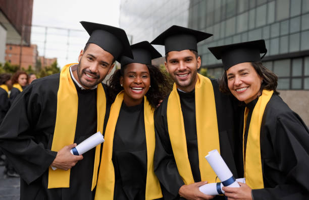 istock Happy group of post graduate students smiling on their graduation 1349302536