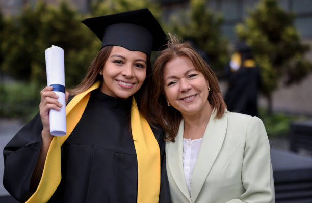 istock Happy graduate student with her mother on graduation day 1349302595