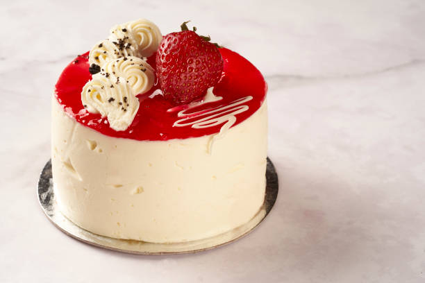 istock cheesecake with strawberries on a white marble background copy space 1349307582
