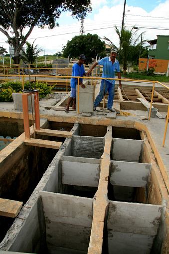 eunapolis, bahia / brazil - february 1, 2009: workers work to clean Embasa's water treatment plant in the city of Eunapolis.