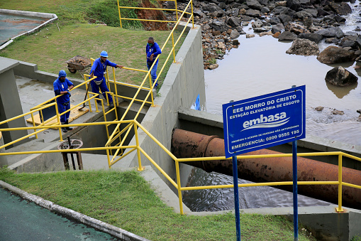 salvador, bahia, brazil - january 15, 2021: workers from Empresa Baiana de Saneamento - Embasa, are seen at a sewage treatment plant on Barra beach in the city of Salvador.