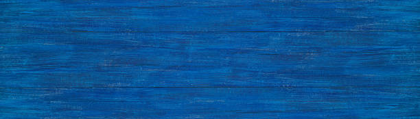 istock blue christmas banner. dark blue wood texture with natural patterns. 1349315388