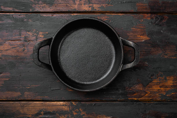 Black Empty clay pot set with copy space for text or food with copy space for text or food, top view flat lay, on old dark  wooden table background