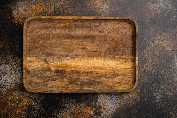 istock Empty wooden cutting board, top view flat lay , with copy space for text or your product, on old dark  wooden table background 1349317604