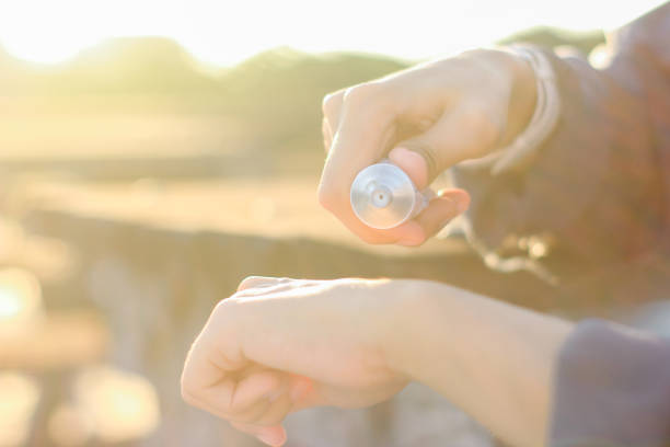 istock young women using sun screen care outdoor 1349318924