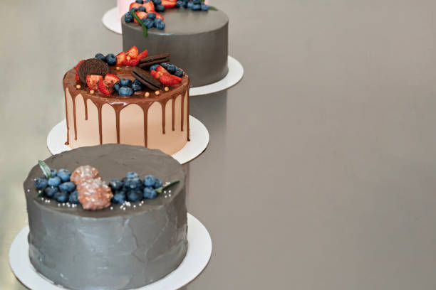 istock Festively decorated cakes on table. Confectionery for holiday. Selective focus 1349319904