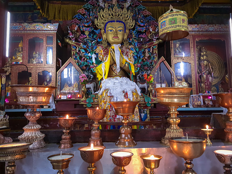 buddha disciple golden statue close up shot at monastery from different perspective image is taken at ghoom monastery darjeeling west bengal india.