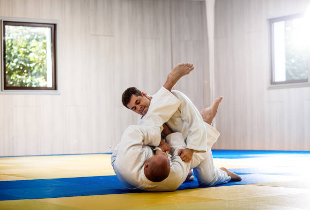 istock Two adult man practicing judo in the sports hall. 1349322875