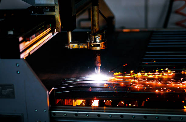 istock Industrial cnc plasma cutting metal plate. 1349323079