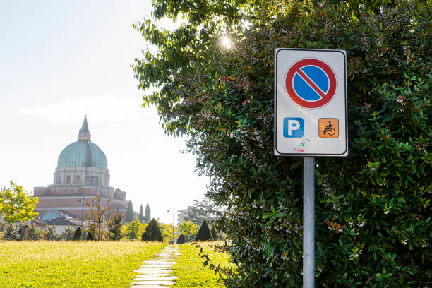 the sign in the area reserved for parking cars for disabled people