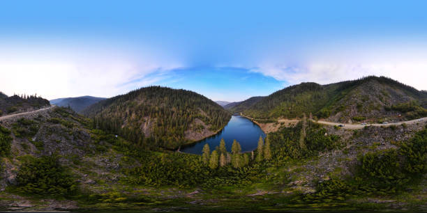 istock Panorama, Mountain Lake, Sunny, Coniferous Forest, Cliffs 1349327352