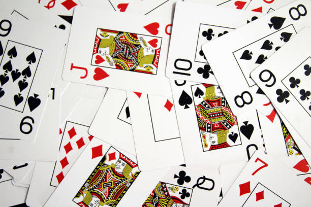 istock Playing cards scattered in pieces 1349328391