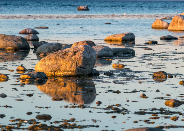 beautiful sunset landscape from a traditional rocky beach on the island of Saaremaa, Cape Undva, Tagamoisa Peninsula, Saaremaa Island, Estonia