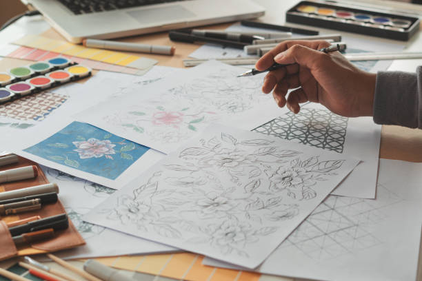 istock Designer designing drawing sketch pattern geometric flower seamless wallpaper fabric textile fashion industry. artistic design studio. 1349328909