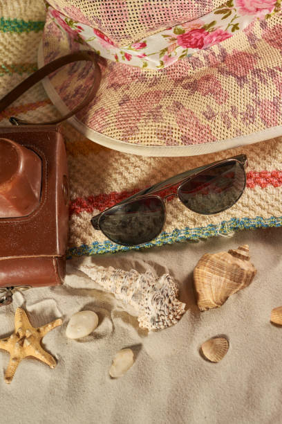 istock Summer still life on a wooden background, sea shells, glasses, starfish 1349330296