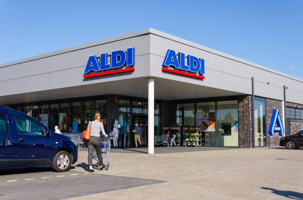 Aldi (stylized as ALDI) is the common brand of two German family-owned discount supermarket chains with over 10,000 stores in 20 countries stock photo