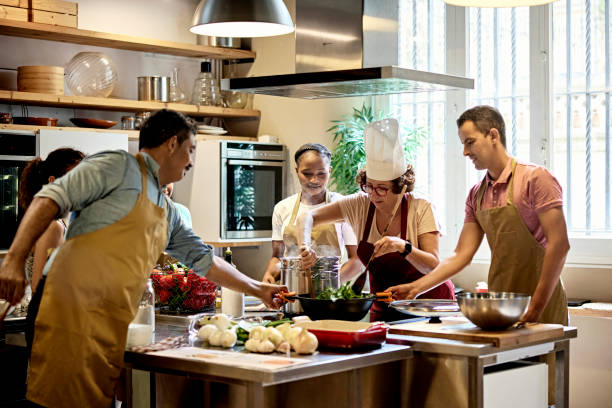 istock Chef Wilting Spinach Leaves in Cooking Class 1349332355