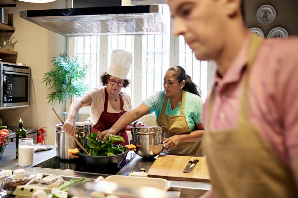 istock Adult Students and Chef in Cooking Class 1349332361