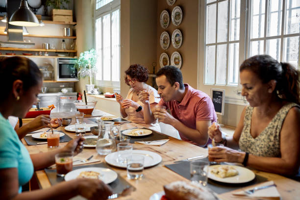 istock Diverse Group of Students Enjoying Meal After Cooking Class 1349332372