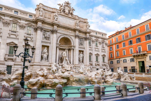 A beautiful and detailed scene of the Baroque masterpiece of the Trevi Fountain in the heart of Rome A stunning and detailed view of the majestic Trevi Fountain, in the historic and baroque heart of the Eternal City. Built in 1732 on the wishes of Pope Clement XII on the facade of the Palazzo Poli by the architect Nicola Salvi, the Trevi Fountain it's one of the masterpiece of the late Roman Baroque, recognized as one of the most beautiful and famous fountain in the world. In 1980 the historic center of Rome was declared a World Heritage Site by Unesco. Image in high definition format. triton greek god stock pictures, royalty-free photos & images
