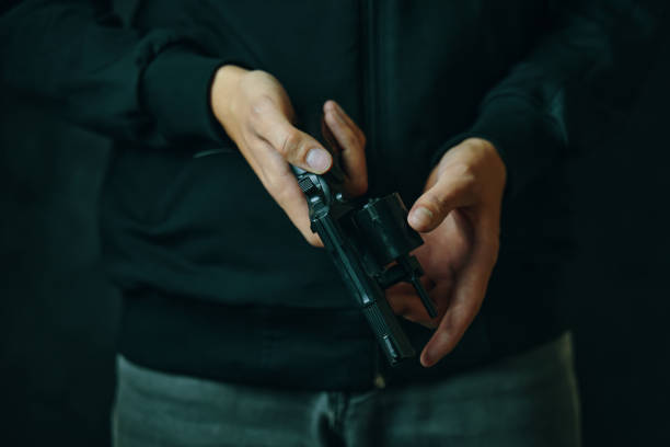 istock Close up of man reloading revolver. 1349334970