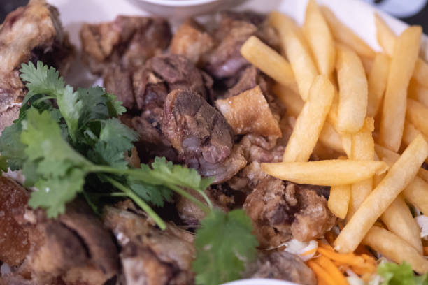 istock Crispy pork legs served with french fried. Close up 1349335845