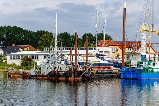 Arnis, Germany - September 07, 2021: View of the harbor, shipyard and city of Arnis