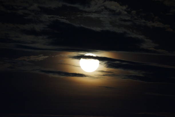 istock Full moon known as Hunter's Moon in between clouds 1349337250