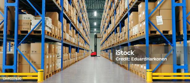 Warehouse With High Shelves And Loader Logistics Concept Stock Photo - Download Image Now