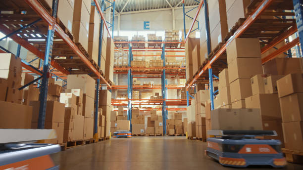 istock Future Technology 3D Concept: Automated Retail Warehouse AGV Robots with Infographics Delivering Cardboard Boxes in Distribution Logistics Center. Automated Guided Vehicles Goods, Products, Packages 1349338197