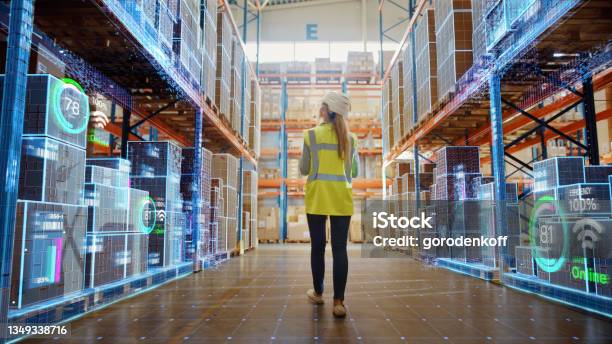 Futuristic Technology Retail Warehouse Worker Doing Inventory Walks When Digitalization Process Analyzes Goods Cardboard Boxes Products With Delivery Infographics In Logistics Distribution Center Stock Photo - Download Image Now