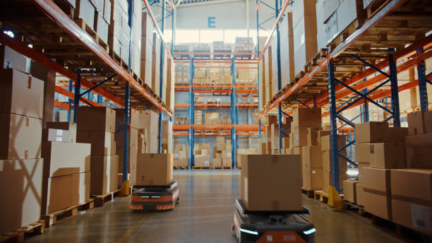 istock Future Technology 3D Concept: Automated Retail Warehouse AGV Robots with Infographics Delivering Cardboard Boxes in Distribution Logistics Center. Automated Guided Vehicles Goods, Products, Packages 1349338717