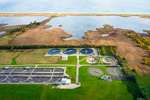 Sewage Treatment Plant near a nature reserve and the ocean in Denmark. Environmental conservation and preservation of clean waters resources is high priority and the Scandinavian countries are at the forefront in development of sustainable solutions for waste water treatment to secure a clean earth for future generations. Besides the waste products are recycled for energy production as green biofuel ultimately leading to decreased CO2 emission, global warming and climate change.