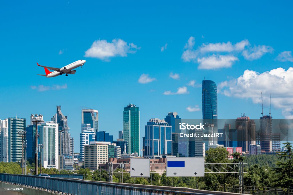 Passenger plane taking off over the city Passenger plane taking off over the city, Istanbul Istanbul Stock Photo