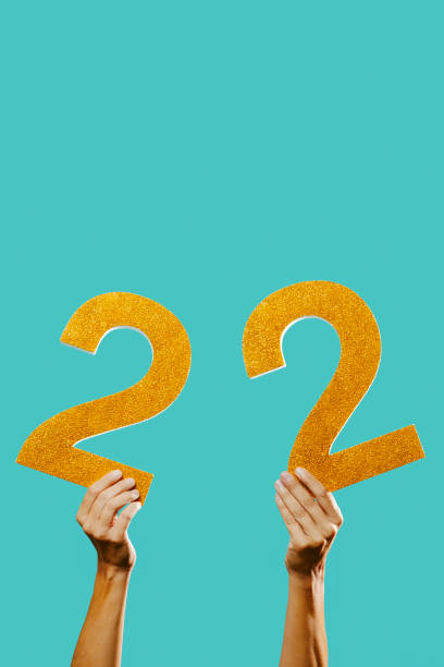 istock man with the number 22 in his hands 1349342526