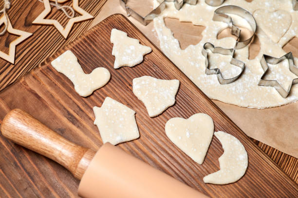 istock Making gingerbread Christmas Cookies Using form for cooking on wooden background 1349343062