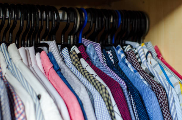 istock Men's shirts on hangers in the wardrobe 1349343078