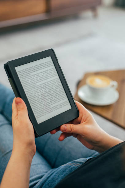 istock Woman Reading E-Book at Home 1349345608
