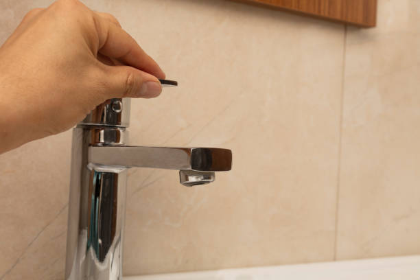 istock Hand opens the water tap. Close up 1349346499